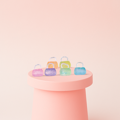 Squishy Handbag with Maltose glitter purse stress relief toys in pink, orange, yellow, purple, green, and blue colors.