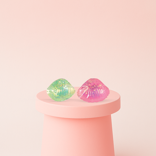 Squishy Shell with Maltose soft EVA stress relief toys in green and pink translucent shell designs.