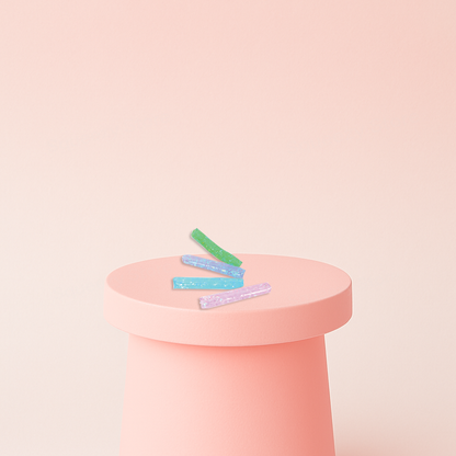 Super Long Water Wiggler glitter-filled sensory tubes in green, blue, purple, and pink colors.