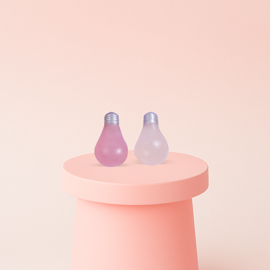 UV Color-Changing Light Bulb with Maltose stress relief toy shown in pale pastel and bright pink color-changing versions.