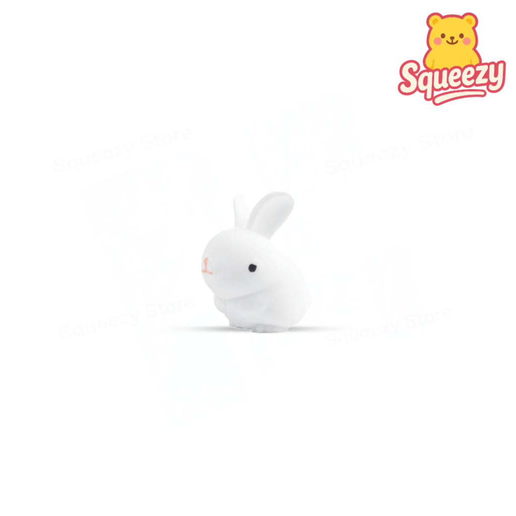 White Lucky Bunny soft sensory toy with black eyes and rounded rabbit shape.